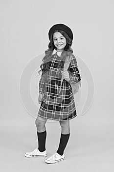 back to school. retro girl wear uniform and parisian beret. kid school fashion. cheerful child ready for schoolyear