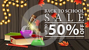 Back to school sale, discount web banner with wooden texture, books and chemical flasks