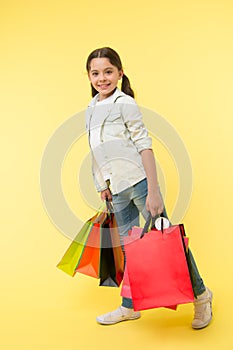 Back to school sales and deals. Back to school season great time to teach budgeting basics children. Girl carries