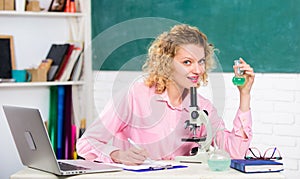 Back to school. School laboratory. Equipment for studying. Investigate molecular modifications. Student girl with laptop