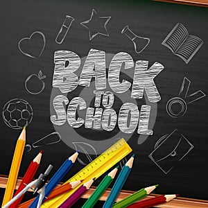 Back to School with school supplies and doodles on chalkboard background