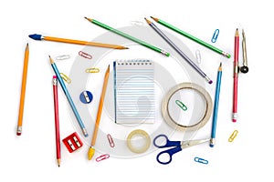 Back to School. School supplies  notebook, pencil, scissors, sharpener, scotch tape, clips  on a white background. Top view,