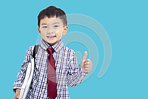 Back to school. Schoolboy student showing the thumbs up