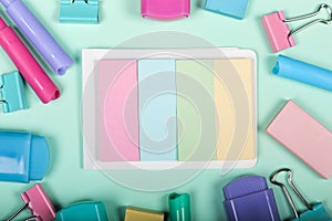 Back to school shopping concept. Pastel colored school supplies on paper background. Flat lay, top view, copy space.