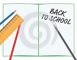 Back to school sign on math notebook, color pencils and orange ruler