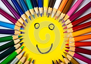 Back to school - smiling face with colored pencils