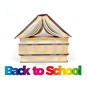 Back to school. Stack of books with  roof on white background. Text