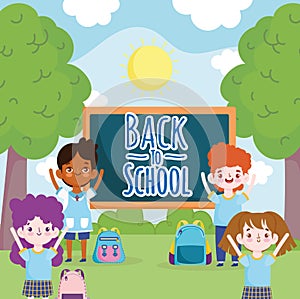 Back to School students characters with blackboard in the park