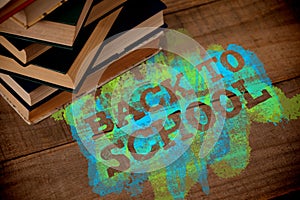 Composite image of back to school text on green and blue splash