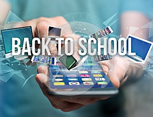 Back to school title surounded by device like smartphone, tablet