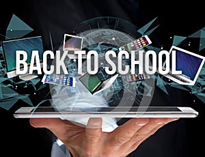 Back to school title surounded by device like smartphone, tablet