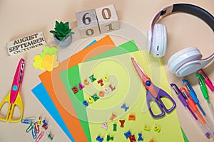 Back to school words made by colorful letters. Top view on different office, study stationary