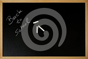 Back to school is written on a blackboard