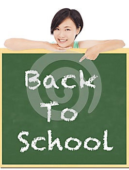 Back to school, young student girl point to blackboard