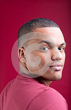 Back-turned, smiling Afro-American man, muscular build