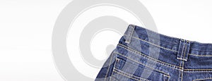 Back upper part of jeans on white background. Copy space. Clothing, online store concepts