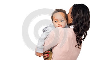 back view of african american mother carrying adorable little child