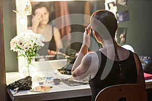 Back View of Artist Doing Make Up by Vanity Mirror