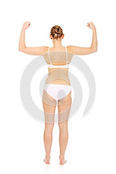 Back view of athletic woman show her muscles