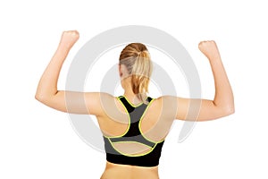 Back view of athletic woman showing muscles