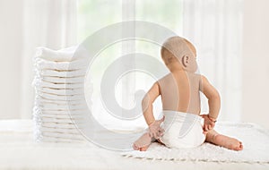 Back view of baby in comfortable disposable diapers
