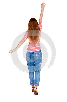 Back view of beautiful woman welcomes.