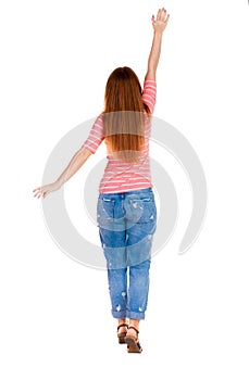 Back view of beautiful woman welcomes. photo