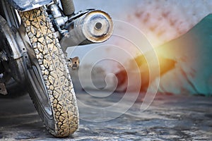 The back view of a bike with silencer in an indian house