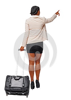 Back view of a black African-American in formal attire walking with a suitcase and pointing hand forward