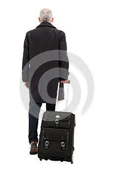 Back view of business man with carry on luggage