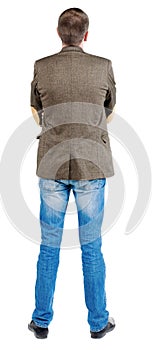 Back view of business man in jacket .