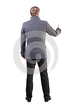 Back view of business man shows thumbs up