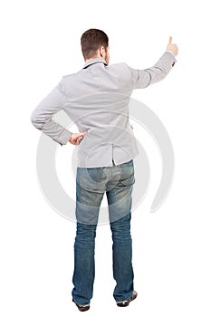 Back view of business man shows thumbs up