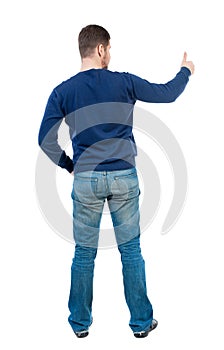 Back view of business man shows thumbs up