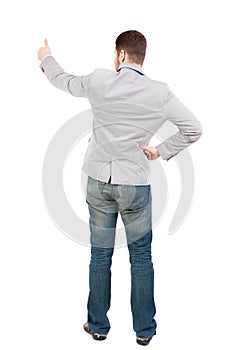 Back view of business man shows thumbs up