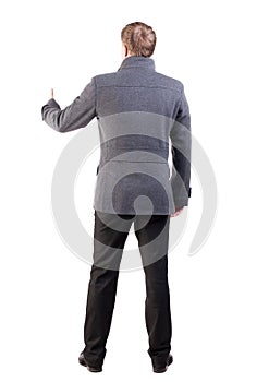 Back view of business man shows thumbs up