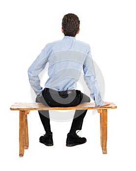 Back view of business man sitting on chair.