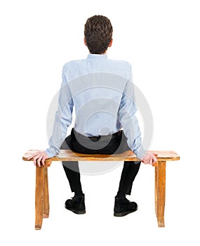 Back view of business man sitting on chair.