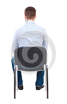 Back view of business man sitting on chair.