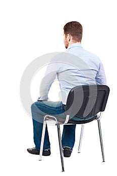 Back view of business man sitting on chair.