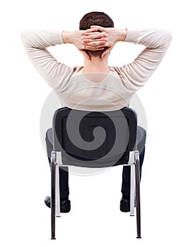 Back view of business man sitting on chair.