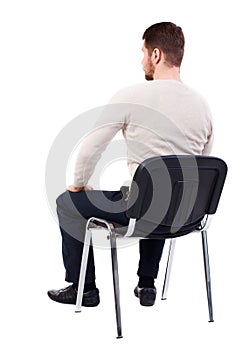 Back view of business man sitting on chair.