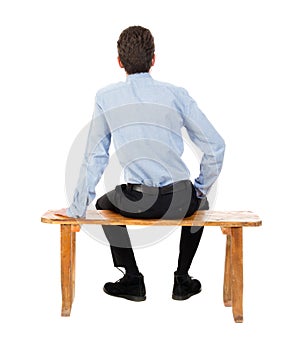 Back view of business man sitting on chair.