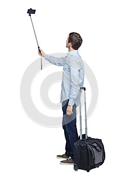 Back view of business man with suitcase with smartphone