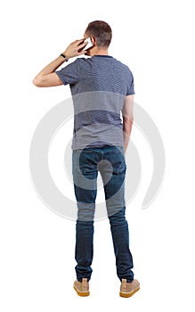 Back view of business man talking on mobile phone