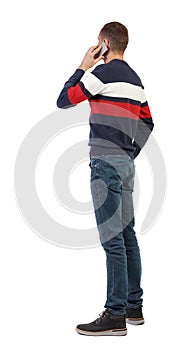 Back view of business man talking on mobile phone