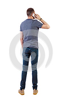 Back view of business man talking on mobile phone