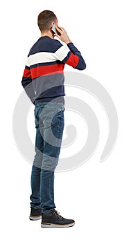 Back view of business man talking on mobile phone