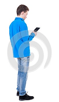 back view of business man uses mobile phone.