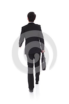 Back view of a business man walking